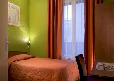 Un ou plusieurs lits dans un hébergement de l'établissement Timhotel Boulogne Rives de Seine