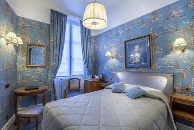Un ou plusieurs lits dans un hébergement de l'établissement Grand Hôtel de L'Univers Saint-Germain