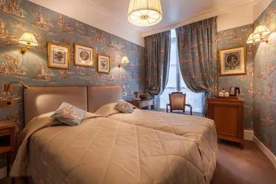 Un ou plusieurs lits dans un hébergement de l'établissement Grand Hôtel de L'Univers Saint-Germain