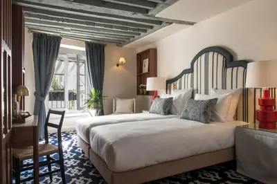 Un ou plusieurs lits dans un hébergement de l'établissement Hôtel Fougère