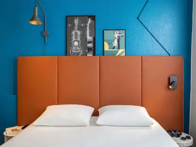 Un ou plusieurs lits dans un hébergement de l'établissement ibis Paris Ornano Montmartre Nord 18ème