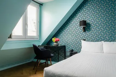 Un ou plusieurs lits dans un hébergement de l'établissement Hotel Elysée Etoile