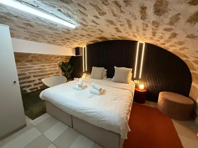 Un ou plusieurs lits dans un hébergement de l'établissement Temple Apartments Paris