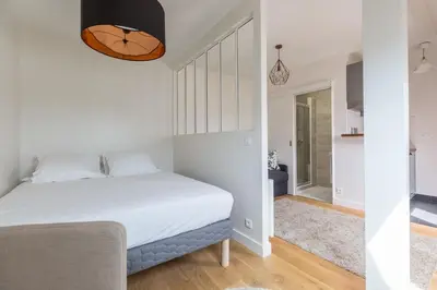 Un ou plusieurs lits dans un hébergement de l'établissement Assas-Vavin Appartements