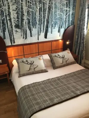 Un ou plusieurs lits dans un hébergement de l'établissement Green hotels Confort Paris 13
