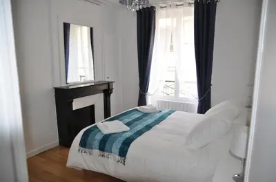 Un ou plusieurs lits dans un hébergement de l'établissement Résidence du Cygne - Swan Residence - Paris centre