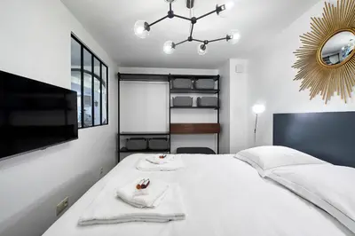 Un ou plusieurs lits dans un hébergement de l'établissement My Maison In Paris - Sentier