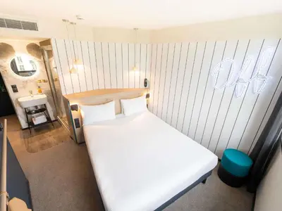 Un ou plusieurs lits dans un hébergement de l'établissement ibis Styles Paris 16 Boulogne