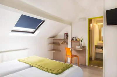 Télévision ou salle de divertissement dans l'établissement Hotel Bel Oranger Gare de Lyon