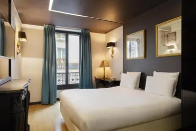 Un ou plusieurs lits dans un hébergement de l'établissement New Hotel République