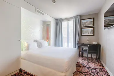 Un ou plusieurs lits dans un hébergement de l'établissement New Hotel République