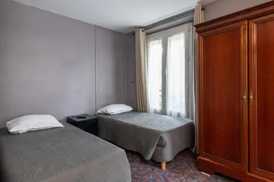 Un ou plusieurs lits dans un hébergement de l'établissement Grand Hôtel De Paris