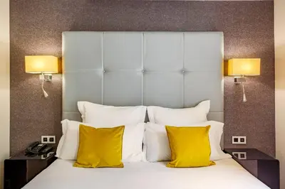 Un ou plusieurs lits dans un hébergement de l'établissement Hotel Opéra Marigny