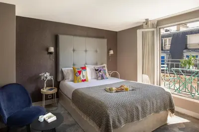 Un ou plusieurs lits dans un hébergement de l'établissement Hotel Opéra Marigny