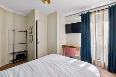Un ou plusieurs lits dans un hébergement de l'établissement Hotel Margot