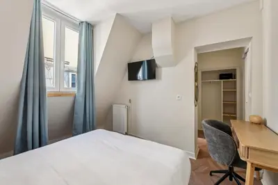Télévision ou salle de divertissement dans l'établissement Hotel Margot