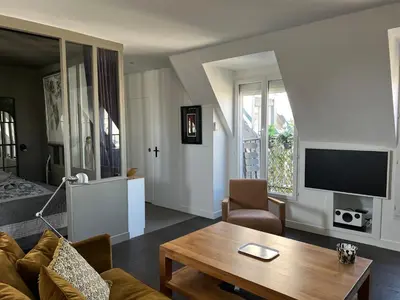 Télévision ou salle de divertissement dans l'établissement Parenthèse idéale Montorgueil loft In Paris