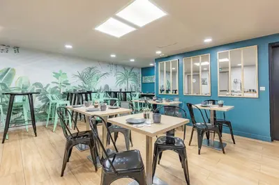 Restaurant ou autre lieu de restauration dans l'établissement Appart'City Classic Paris La Villette