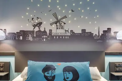 Un ou plusieurs lits dans un hébergement de l'établissement Hôtel Lucien & Marinette