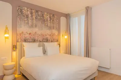 Un ou plusieurs lits dans un hébergement de l'établissement Bobo's hotel