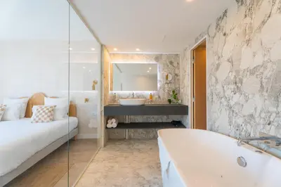 Un ou plusieurs lits dans un hébergement de l'établissement Bobo's hotel