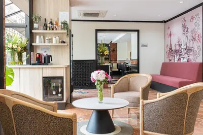 Coin salon dans l'établissement Hôtel Opera Lafayette