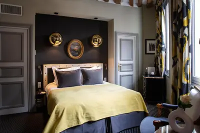 Un ou plusieurs lits dans un hébergement de l'établissement Hôtel Le Relais Saint-Germain