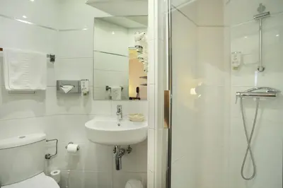 Salle de bains dans l'établissement Hotel Murat