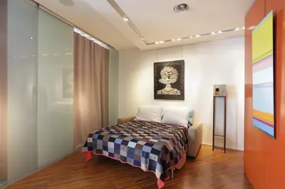 Un ou plusieurs lits dans un hébergement de l'établissement Terrace Matignon Apartment