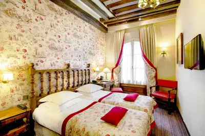 Un ou plusieurs lits dans un hébergement de l'établissement Hotel Left Bank Saint Germain