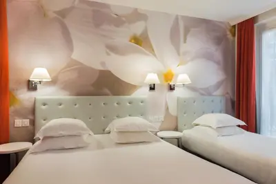 Un ou plusieurs lits dans un hébergement de l'établissement Hôtel Albe Saint Michel