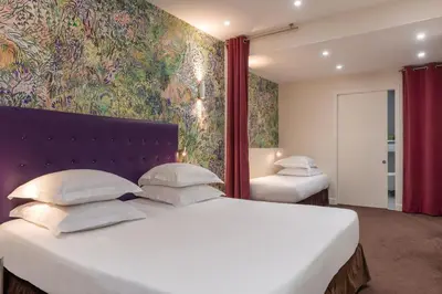 Un ou plusieurs lits dans un hébergement de l'établissement Hôtel Albe Saint Michel