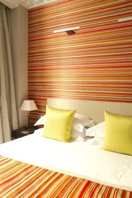 Un ou plusieurs lits dans un hébergement de l'établissement Le Mathurin Hotel & Spa