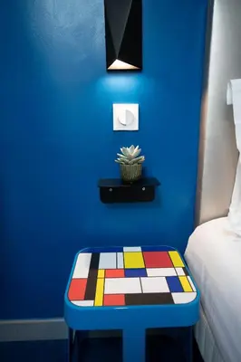 Un ou plusieurs lits dans un hébergement de l'établissement Hôtel Du Mont Dore Batignolles