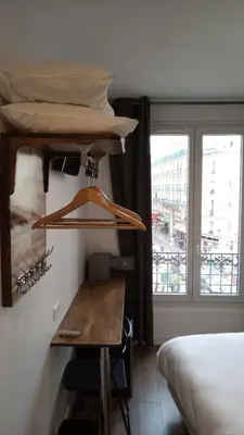 Un ou plusieurs lits dans un hébergement de l'établissement Hôtel De La Perdrix Rouge