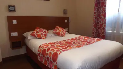 Un ou plusieurs lits dans un hébergement de l'établissement Hôtel de la Place des Alpes