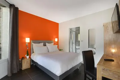 Un ou plusieurs lits dans un hébergement de l'établissement Hotel Douglas