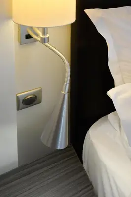 Un ou plusieurs lits dans un hébergement de l'établissement Hotel Douglas