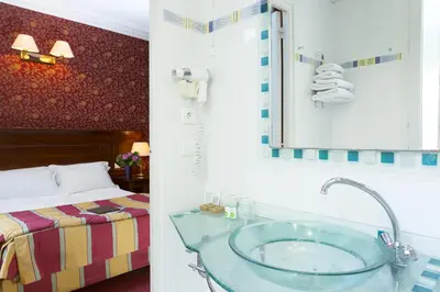 Un ou plusieurs lits dans un hébergement de l'établissement Elysees Niel Hotel