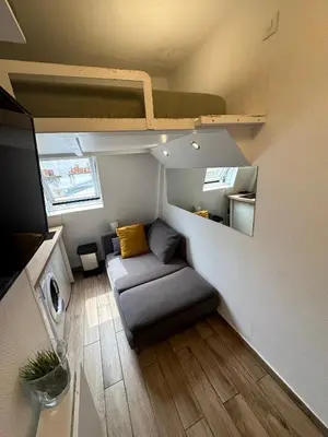 Un ou plusieurs lits dans un hébergement de l'établissement Le Studio du Palais