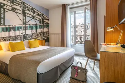 Un ou plusieurs lits dans un hébergement de l'établissement Le 20 Prieuré Hôtel