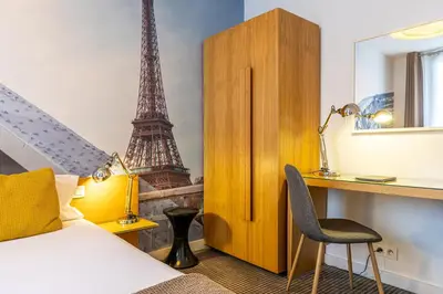 Un ou plusieurs lits dans un hébergement de l'établissement Le 20 Prieuré Hôtel
