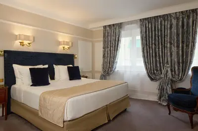 Un ou plusieurs lits dans un hébergement de l'établissement Majestic Hotel Spa - Champs Elysées