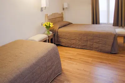 Un ou plusieurs lits dans un hébergement de l'établissement Hôtel Du Printemps