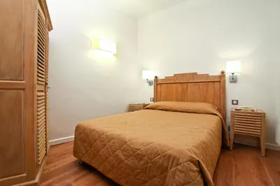 Un ou plusieurs lits dans un hébergement de l'établissement Hôtel Du Printemps