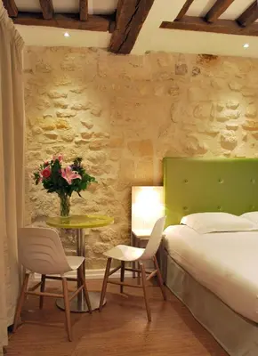Un ou plusieurs lits dans un hébergement de l'établissement Hôtel De La Herse d'Or