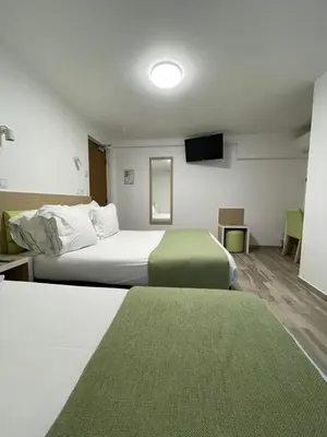 Un ou plusieurs lits dans un hébergement de l'établissement Hôtel De La Herse d'Or