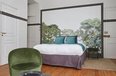 Un ou plusieurs lits dans un hébergement de l'établissement Sourire Boutique Hôtel Particulier