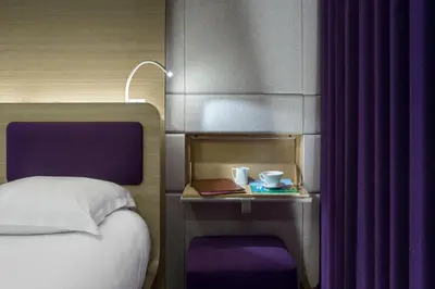 Un ou plusieurs lits dans un hébergement de l'établissement Hôtel Odyssey