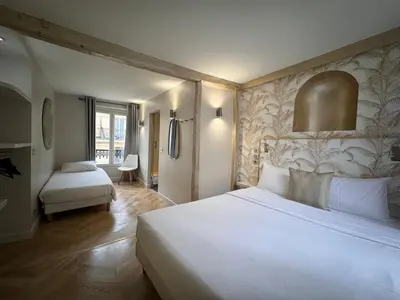Un ou plusieurs lits dans un hébergement de l'établissement Hotel Nation Montmartre